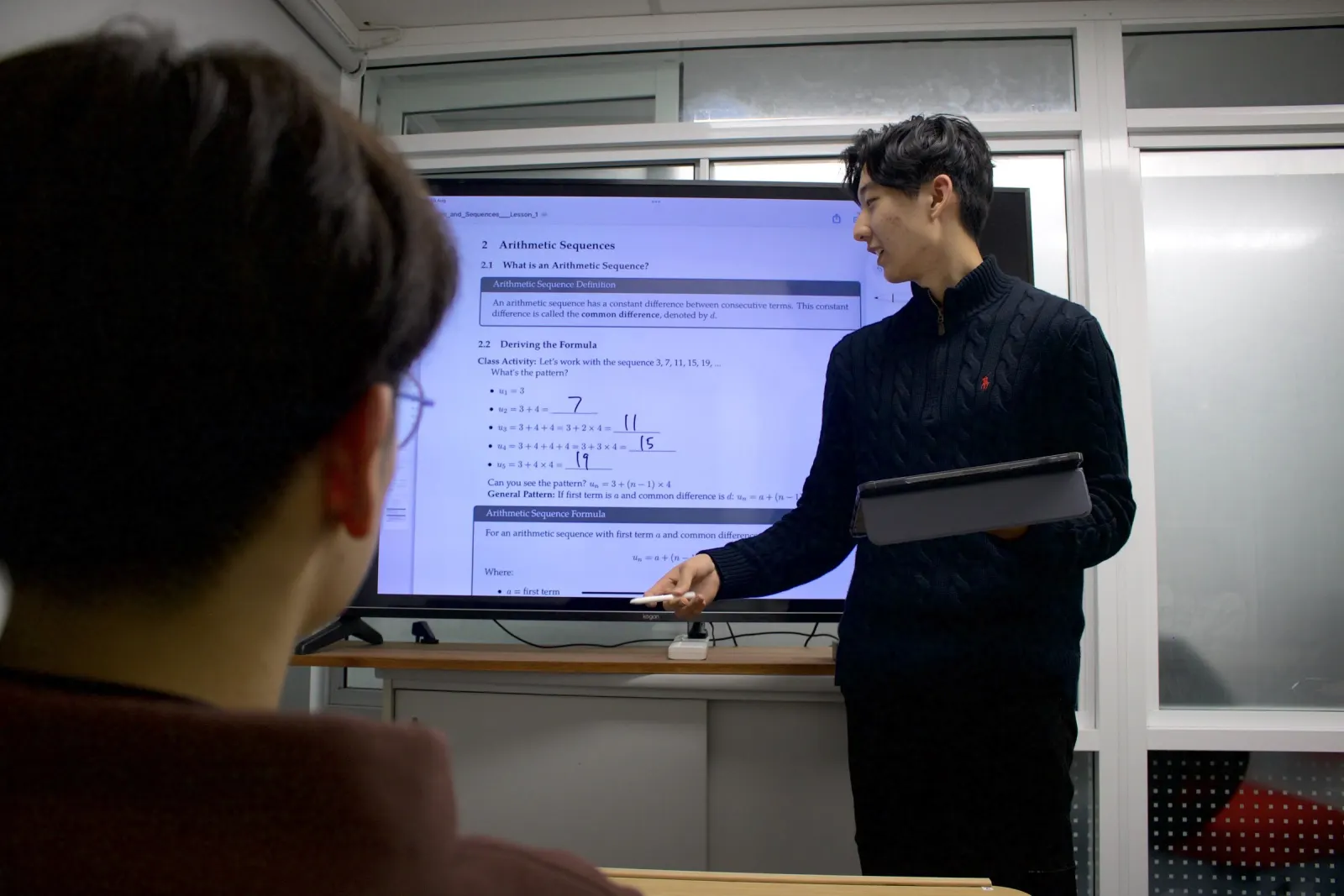 A BEAM tutor explaining a topic at the classroom screen